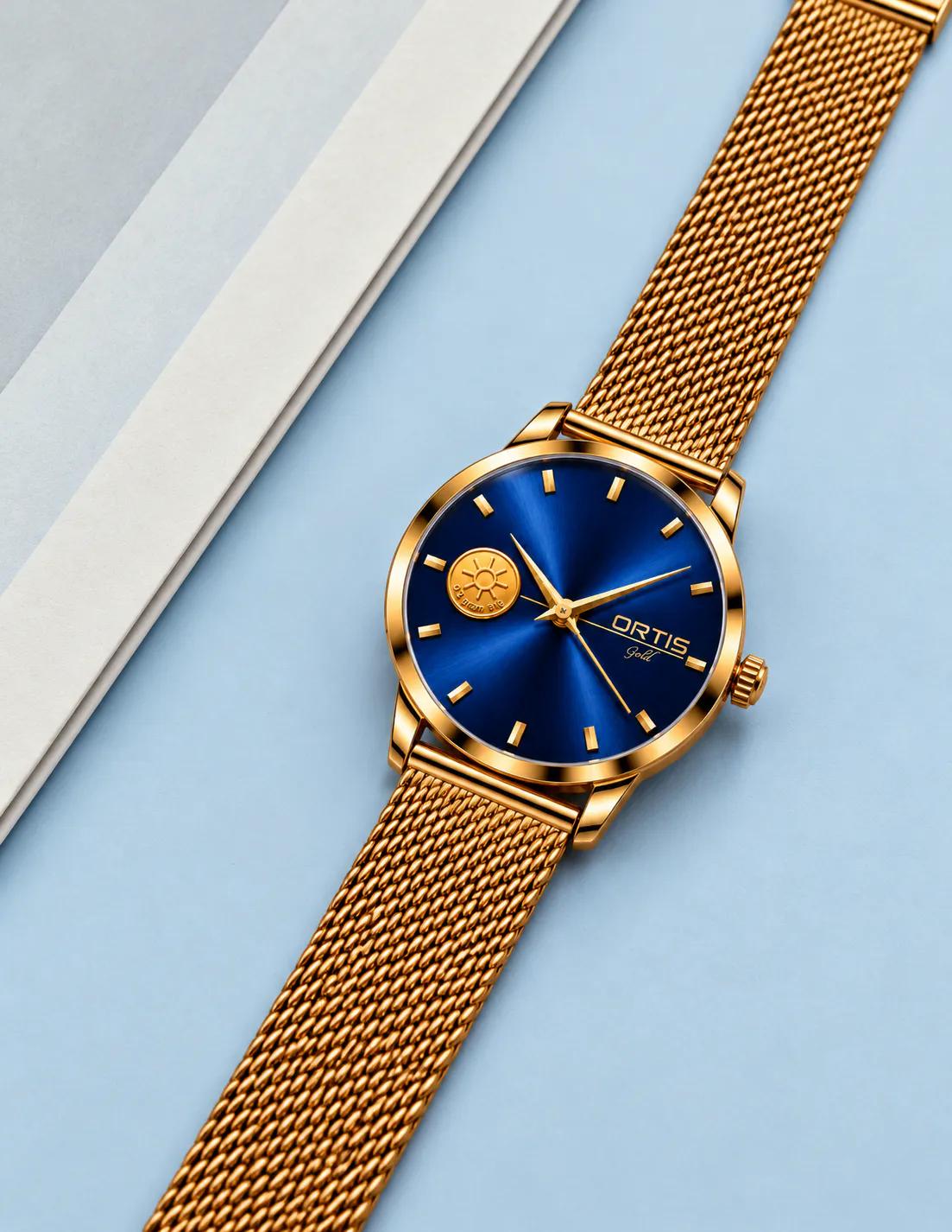 ORTIS men's blue dial watch on light blue background
