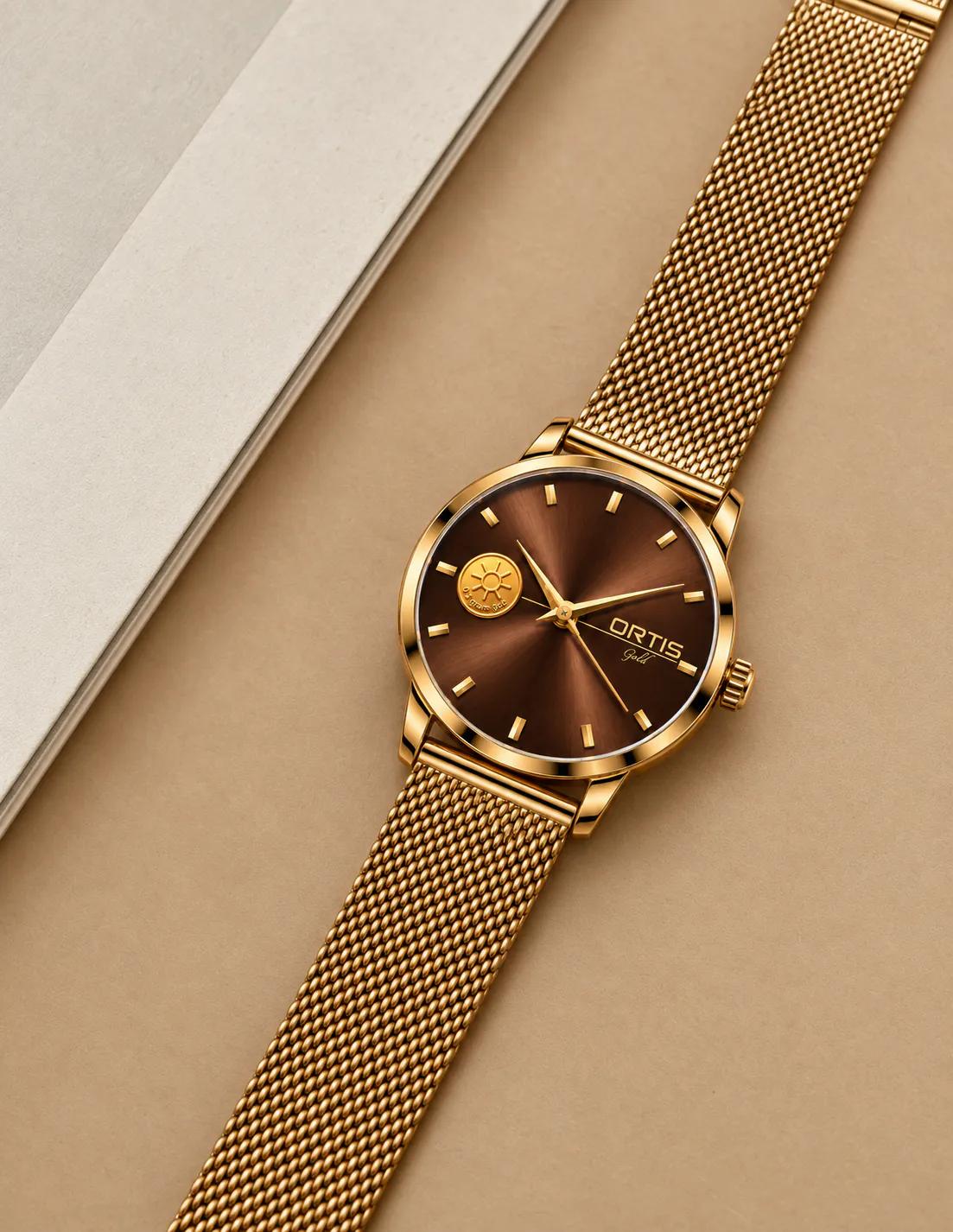 ORTIS men's brown dial watch on tan background